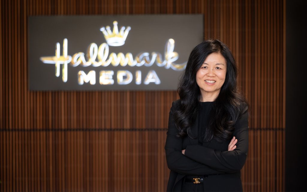 Leslie Park stands in front of the Hallmark Media sign in her L.A. office.