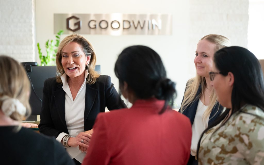 Melanie Gray speaks with a group of students at Goodwin Proctor
