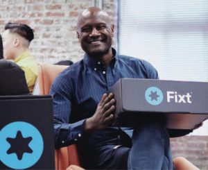 Photo of Luke Cooper L’01 holding a box that says Fixt