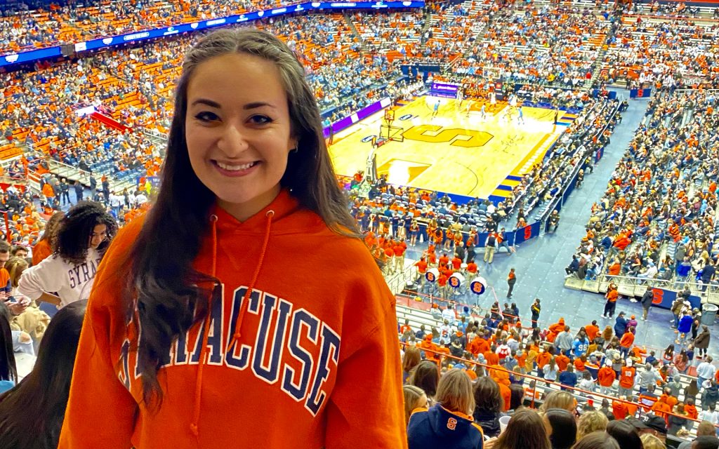 Gilman at a Syracuse basketball game in the JMA Wireless Dome during her undergrad