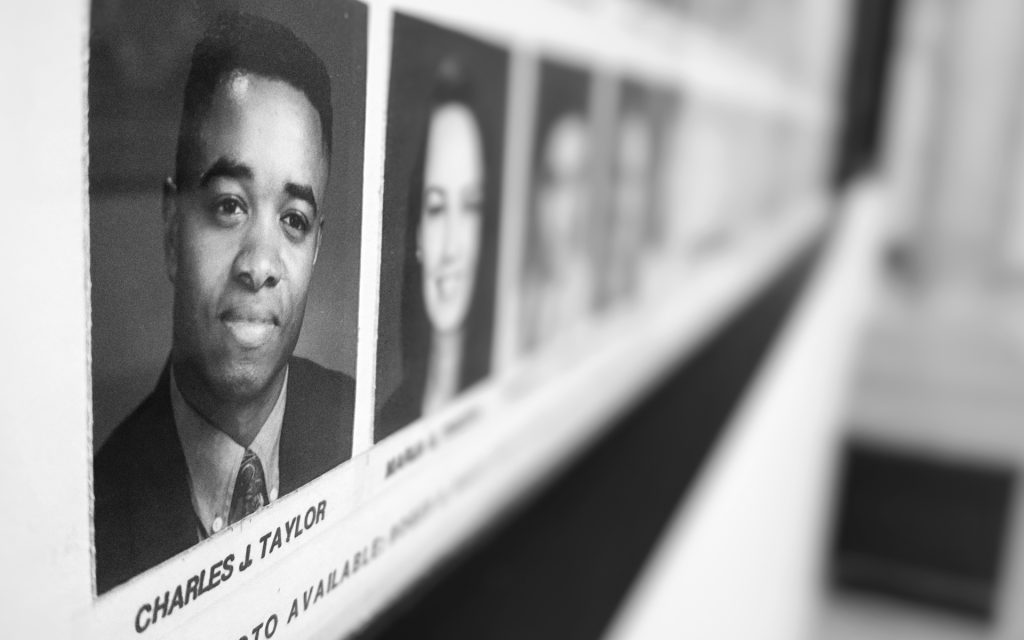 Charles Taylor's photo on the Class of 1996 graduation composite in Dineen Hall