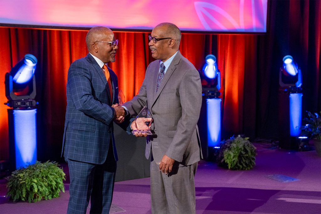 Craig M. Boise presents the Black Law Student Association (BLSA) William Herbert Johnson Legacy Award to John Elmore L’84.