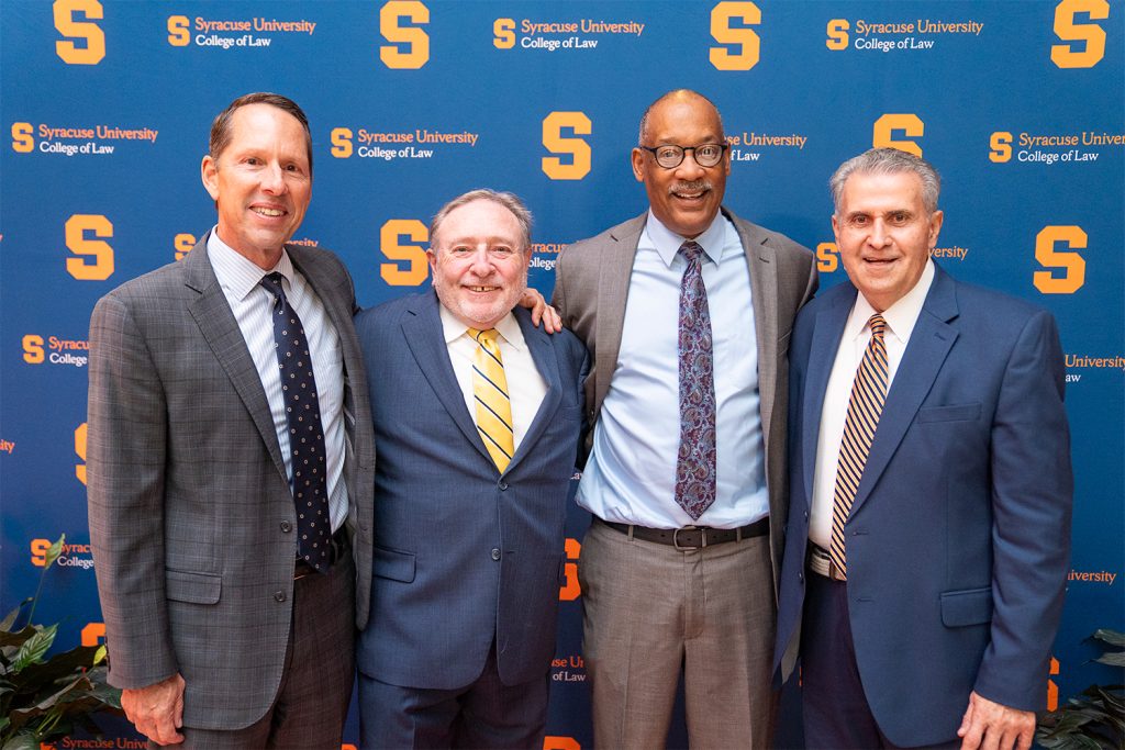 John Elmore L’84 and friends pose for a photo during the after-party.