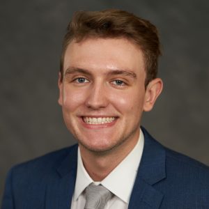 Headshot of Jared Park in front of a gray background