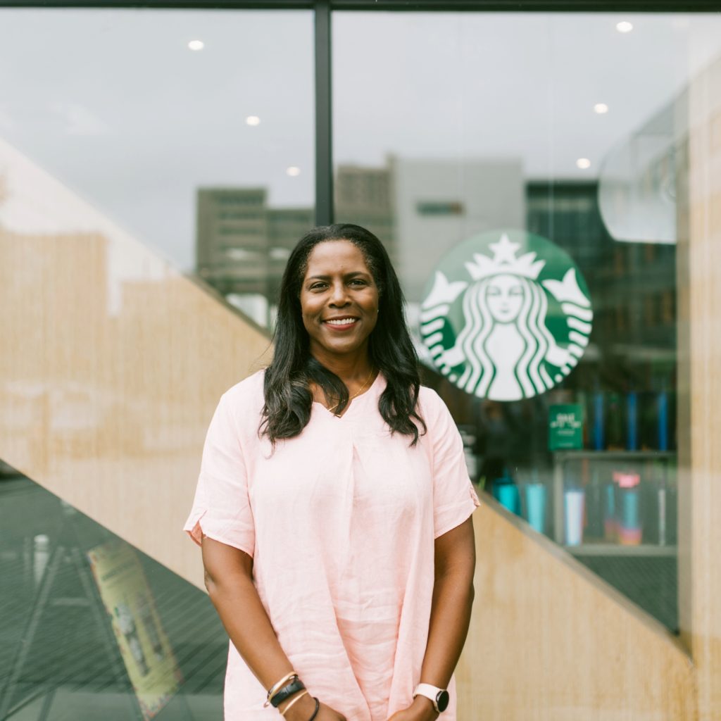 Zabrina Jenkins standing in front of Starbucks.
