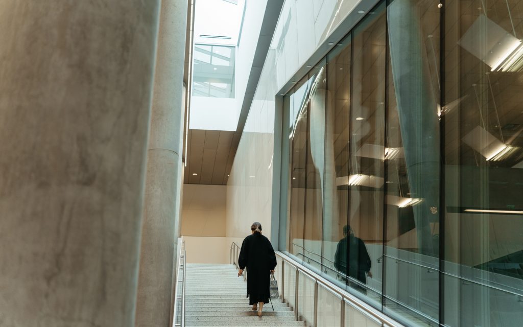 Kang walks up the stairs in Dineen Hall
