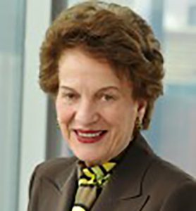 headshot of Judith Kaye smiling at the camera in a brown suit