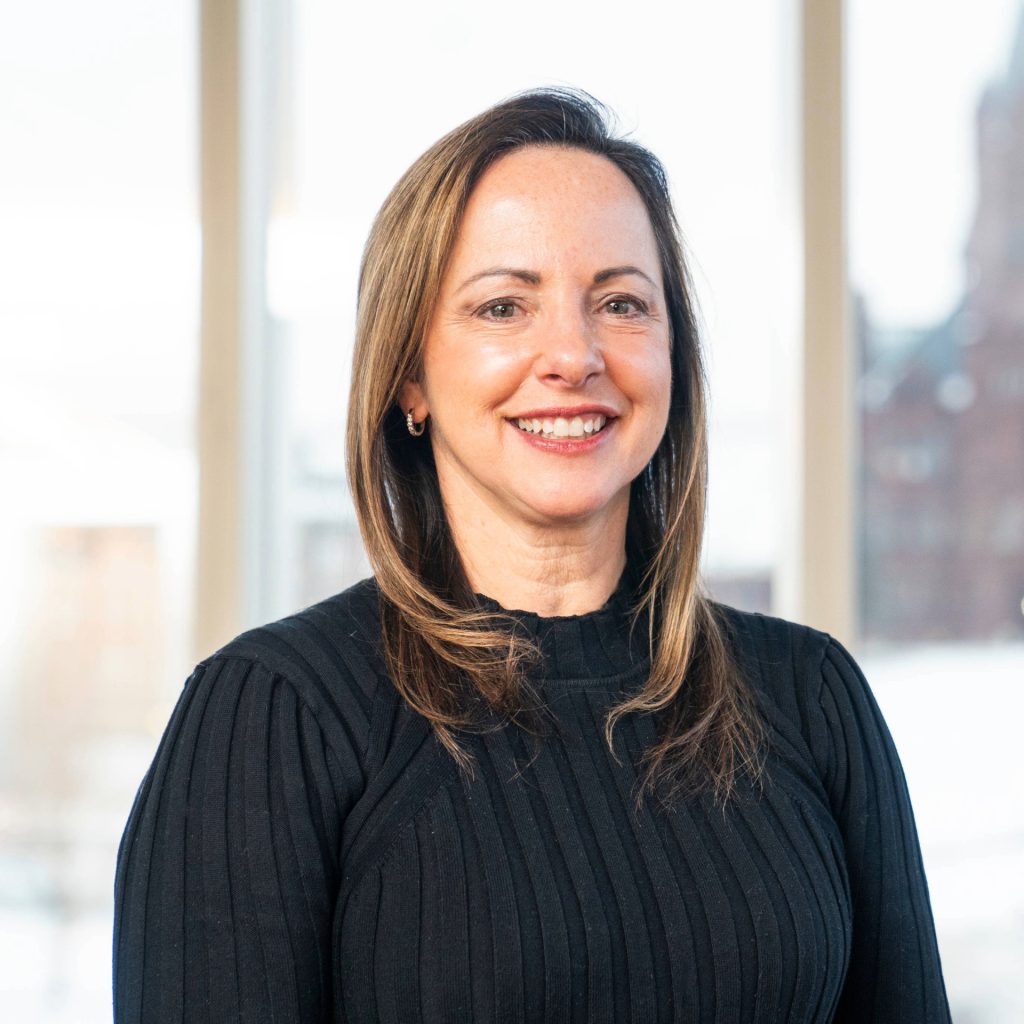 Headshot of Beth Kubala in front of window.