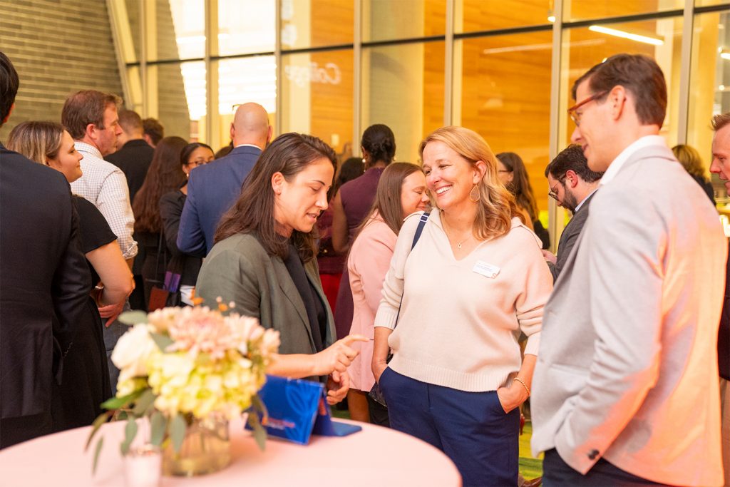 Professor Maria Cudowska (left) chats with Professor Lauryn Gouldin (center) and Assistant Dean of International Programs Andrew Horsfall (right).
