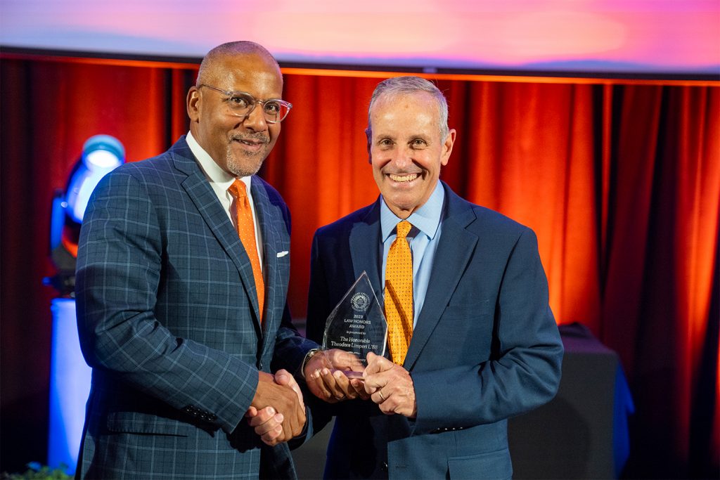 Dean Craig M. Boise presents a Law Honors Award to The Hon. Theodore “Ted” Limpert L’88.