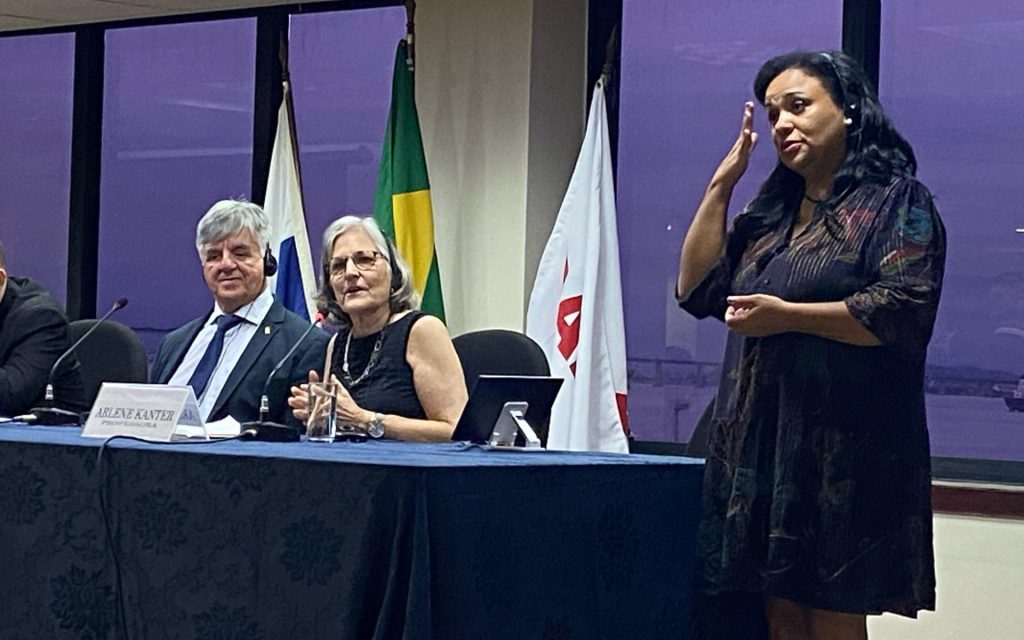 Professor Arlene Kanter speaking on a panel at an event in Brazil