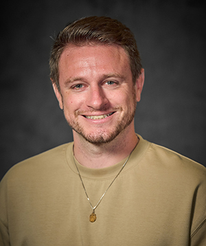 Headshot of Rick Curtis on a gray background