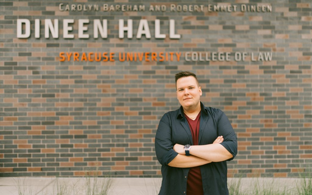 Michal Stokowski poses in front of Dineen Hall