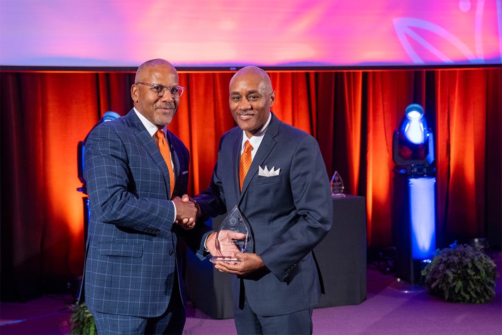 The Hon. Rodney Thompson G’93, L’93 accepts a Law Honors Award from Dean Craig M. Boise.