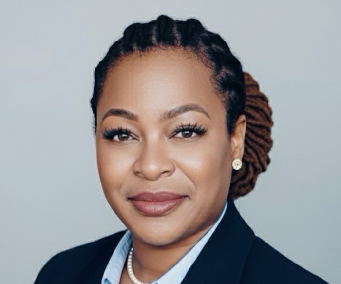 Headshot of Tiffany Johnson in front of a gray background