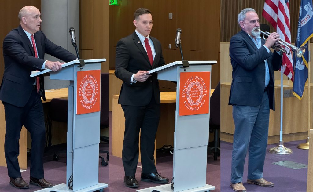 The Hon. James E .Baker, Richard Naperkowski L'23 and David Driesen playing taps