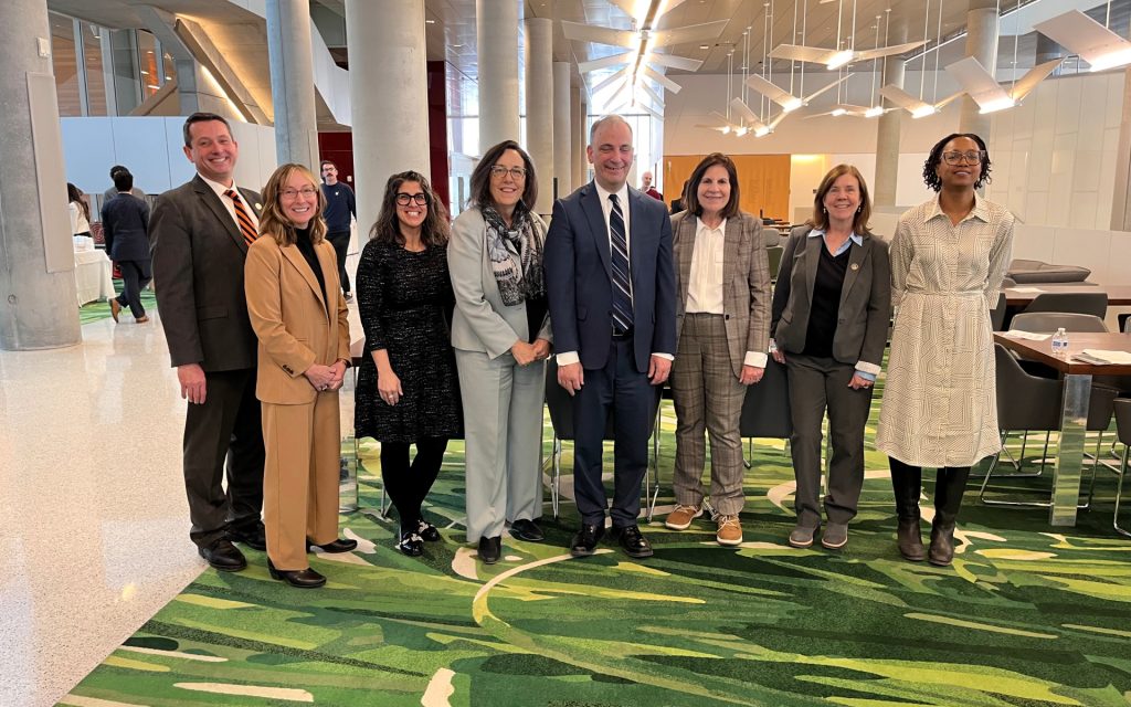 Eight Central New York judges standing in a line in Dineen hall
