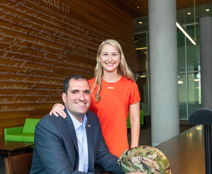 Ryan Marquette L’22 with his wife Vanessa  in the SU Law Library