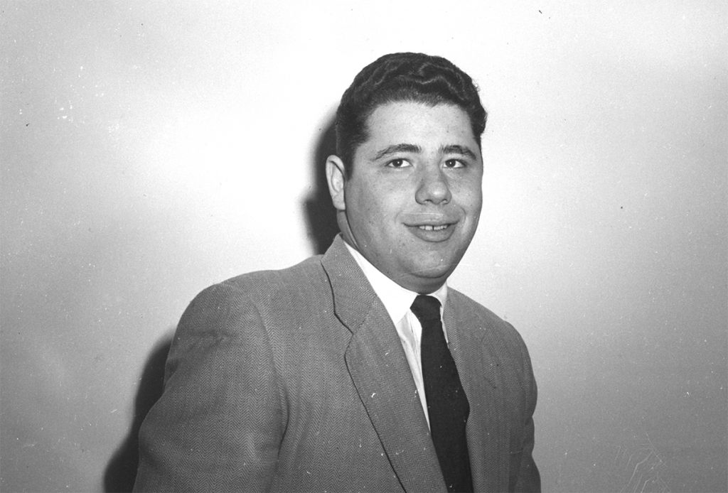 Bernie Kossar poses for a his law school  application photo in a suit and tie